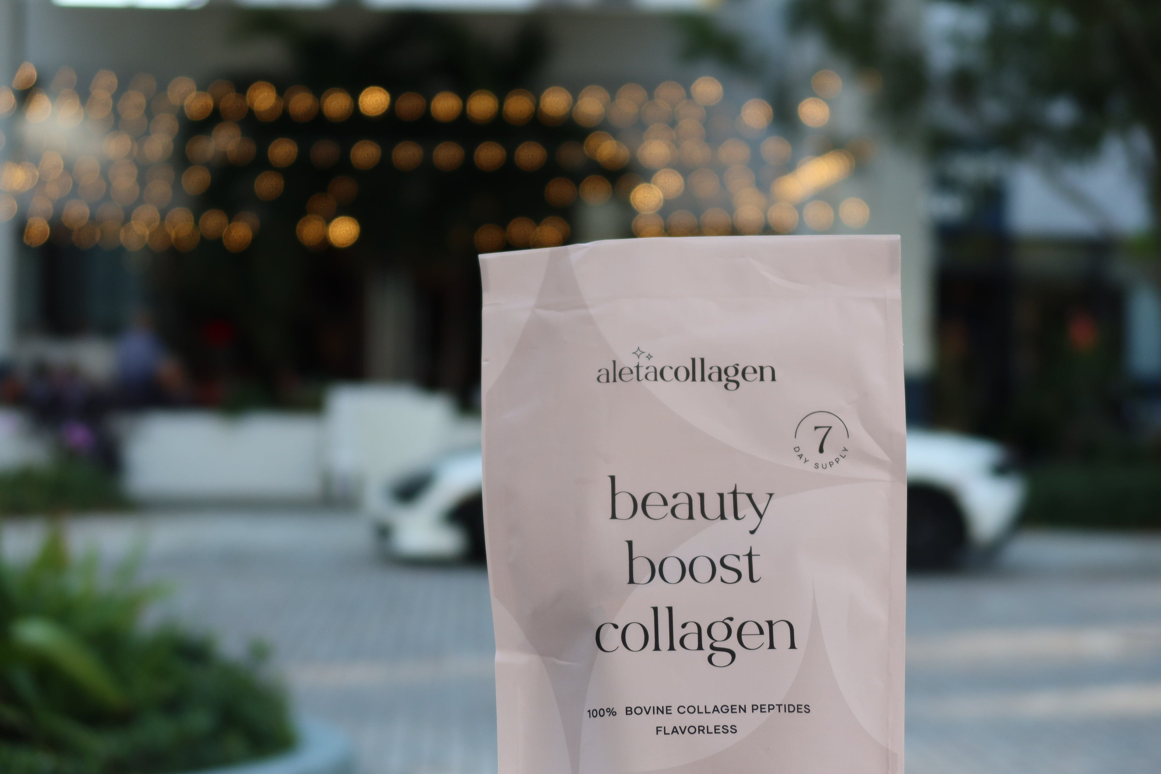 Package of aletacollagen beauty boost collagen with a blurred outdoor background