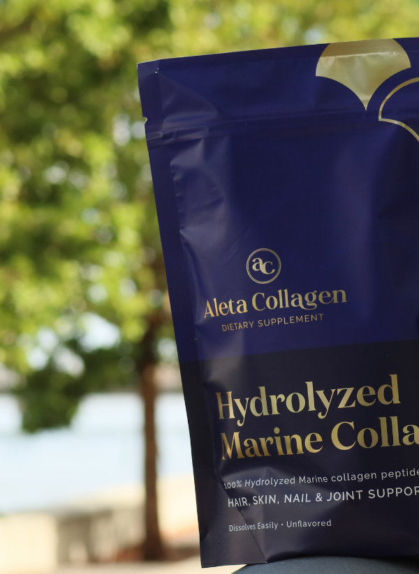 Aleta Collagen dietary supplement package with a blurred natural background